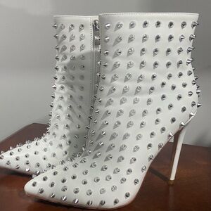 White spike heels